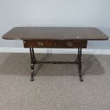 A Reproduction Drop leaf Sofa Table, with two frieze drawers and turned columns, on small out