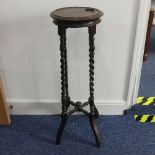 An Edwardian barley-twist Torchere Plant Stand, circular top on barley twist supports connected by a