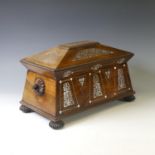 A Rosewood and Mother of Pearl Tea Caddy, of sarcophagus shape, the hinged lid opening to reveal a