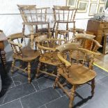 A set of eight elm and beech Smokers Bow Chairs, with turned spindles, shaped seat and H
