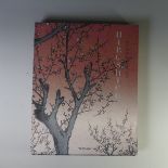 A book of Japanese prints published by Taschen, one hundred famous views of Edo by Hiroshige, string