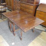 A Georgian mahogany drop-leaf Table, with double frieze drawer, raised on turned legs, one leg