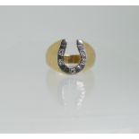 A gentleman's 18ct gold Ring, the front in the form of a white gold horseshoe set with five