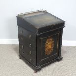 A 19thC ebonised swivel-top Davenport, the lift-up top with tooled green leather skiver, revealing a
