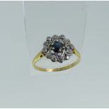 A small sapphire and diamond Cluster Ring, all mounted in 18ct yellow and white gold, Size S, approx
