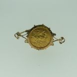 An Edward VII gold Sovereign, dated 1903, Perth mint mark, in 9ct gold brooch mount with metal