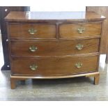A George III mahogany Bowfront Chest of Drawers, comprising two short over two long drawers, on