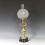 A Victorian Hinks patent brass Oil Lamp, having an opaque glass shade and clear glass font, on