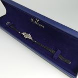 A small 14ct white gold Bulova lady's Cocktail Watch, with diamond points above and below the