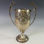 A George V silver two handled Trophy Cup, by C W Fletcher & Son Ltd., hallmarked Sheffield, 1929, of