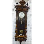 An early 20th century walnut Vienna regulator style wall Clock, the 8-day single weight movement