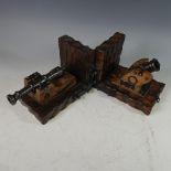 A pair of decorative 'gun' Bookends, modelled as cannons on wooden base, W 26cm x D 16cm x H 15cm (