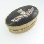 A Scottish 19thC oval horn Snuff Box, the lift off cover with an applied thistle motif, unmarked but