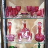A Mary Gregory cranberry glass Jug and Beaker Set, with figural decoration, H 25cm, together with