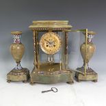 A late 19thC French green/red marble Clock garniture, the mantel clock of four-glass form with brass