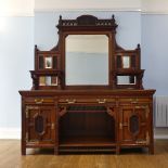 An Aesthetic Movement Maple & Co mahogany Sideboard, the gallery back with a large central mirror,