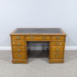 An Edwardian oak twin pedestal Desk, with leather inset top, with three frieze drawers below and
