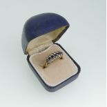 A sapphire and white paste three row Ring, mounted in 9ct yellow gold, Size Q, approx total weight