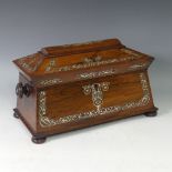 A rosewood and mother of pearl Tea Caddy, of sarcophagus shape, the hinged lid opening to reveal a