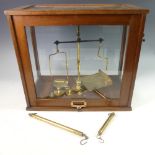 An antique cased Set of Balance Scales, with weights, W 45cm x D 24cm x H 40cm.