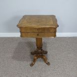 A Victorian walnut Work Table, with quarter-veneered top opening to reveal a fitted interior with