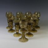 A set of nine German etched green glass Hock Glasses, the bowls with etched grape vine decoration,