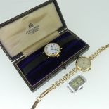 An 18ct gold lady's Wristwatch, the dial indistictly signed J. W. Benson, on black ribbon strap,