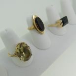 A 9ct yellow gold Dress Ring, claw set with an oval facetted citrine, 18mm long, Size P, together