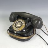 A Belgian Bell Rotary Telephone, having a metal back and brass dial, numbered RTT-56 A on underside,