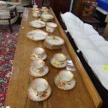 A Nautilus Scottish porcelain floral Tea Service, comprising of eleven Cups, twelve Saucers, two