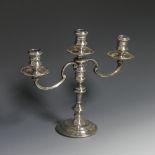 An Elizabeth II silver three light candelabrum, by William Comyns & Sons Ltd., the stick