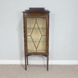 An Edwardian mahogany astragal glazed Display Cabinet, with central door opening to two shelves,