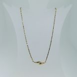 An 18ct yellow gold Necklace, the integral pendant in two colour gold, 39cm long, approx weight 10g.