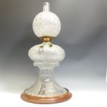 A 19thC Cut Crystal Oil Lamp, attributed to F & C Osler on wooden base D14cm, H25cm without base,