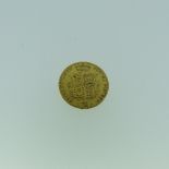 A Victorian gold Half Sovereign, dated 1877, with shield back.