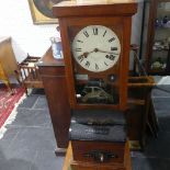 An early 20thC oak cased Clocking-in Machine, by the National Time Recorder Ltd, the Roman numeral