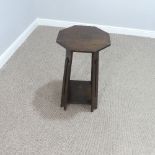 An Arts and Crafts oak octagonal side Table, the supports with pierced motifs, W 38cm x D 38cm x H