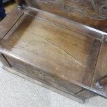 A Victorian carved oak Monks Bench, of rectangular form, with typical hinged box seat base, and