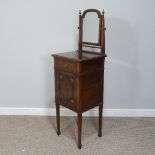 An Edwardian mahogany Washstand, with a mirror above a frieze drawer and cupboard below, on tapering
