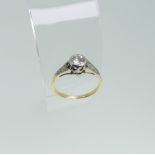 A single stone diamond Ring, the stone c.0.4ct, millegrain set and with two diamond points on each