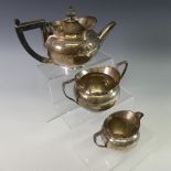 A Victorian silver three piece bachelor's Tea Set, by Hukin & Heath, hallmarked Birmingham, 1893, of