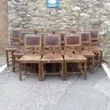 A set of twelve early 20thC French walnut and leather Dining Chairs, the padded back rests with