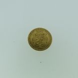 A Victorian gold Half Sovereign, dated 1885, with shield back.