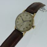 A vintage Smiths Deluxe 9ct gold gentleman's Wristwatch, with 15-jewels movement, the circular