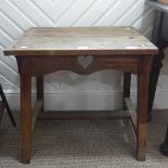 An Arts & Crafts Occasional Table, with rectangular top above square legs carved with an arts and
