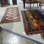 Tribal rugs; a Pakistani prayer rug, hand-knotted with Gul designs on an orange ground, 100% wool,