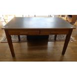 A mid 20thC oak utility furniture Writing Desk, the rectangular top inset with black leatherette,