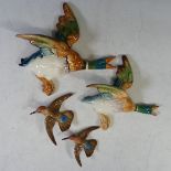 A pair of Beswick flying Ducks, model no 596-2 and 596-3, together with a pair of Beswick