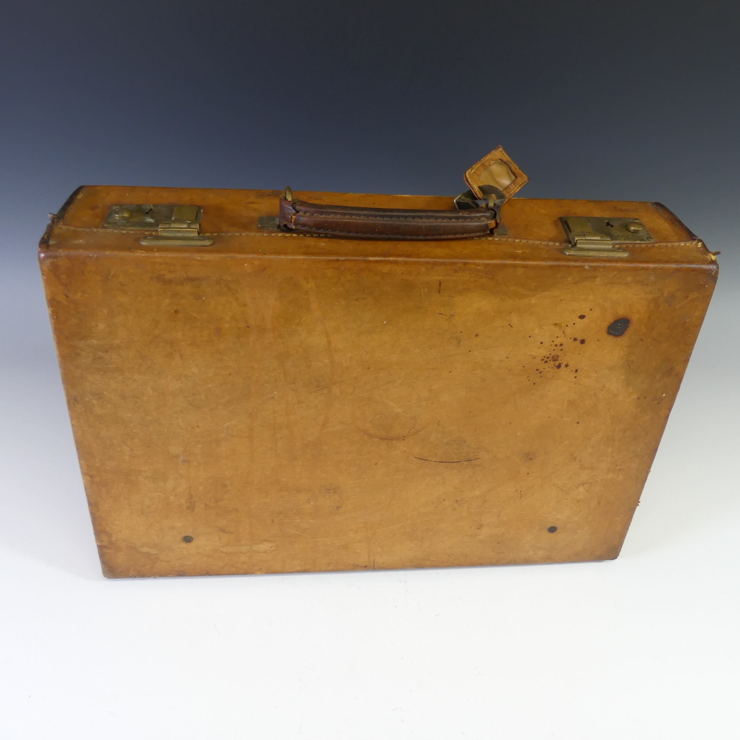 A vintage "Harrods" tan leather Suitcase, with brass locks, the red interior marked "Harrods", no - Image 2 of 3