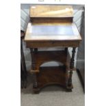 A Victorian walnut Davenport Desk, the hinged stationery compartment, lifting to reveal inkwells,